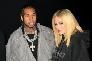 Avril Lavigne Kisses Tyga During Paris Fashion Week